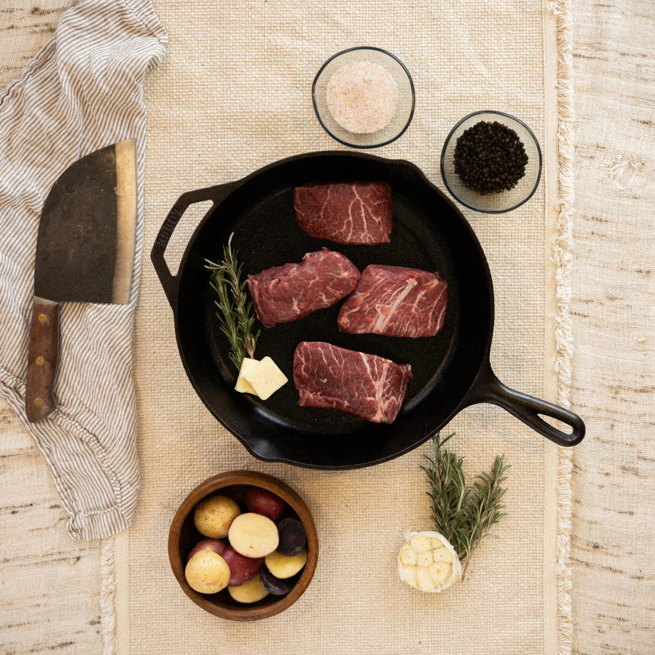 Flat Iron Steak with a sprig of parsley on top of it